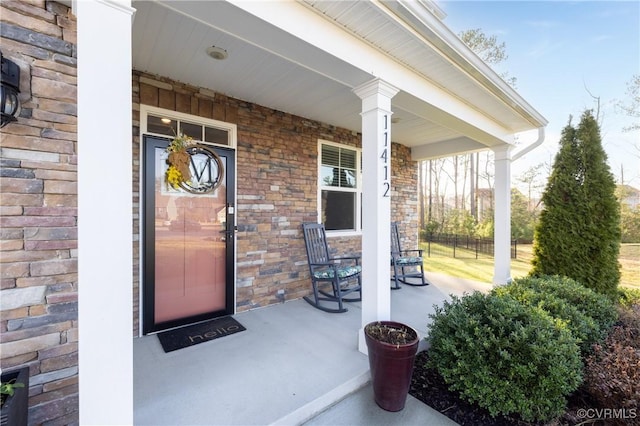 entrance to property featuring a porch