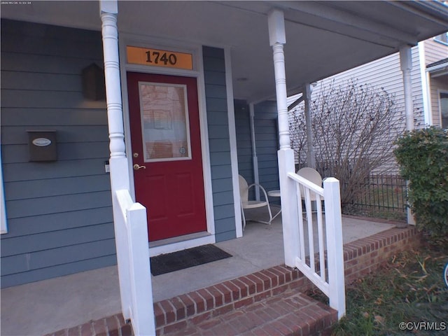 property entrance with covered porch