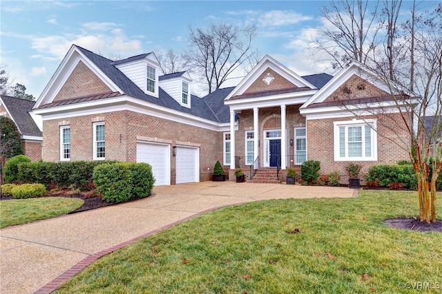 view of front of property with a garage and a front yard