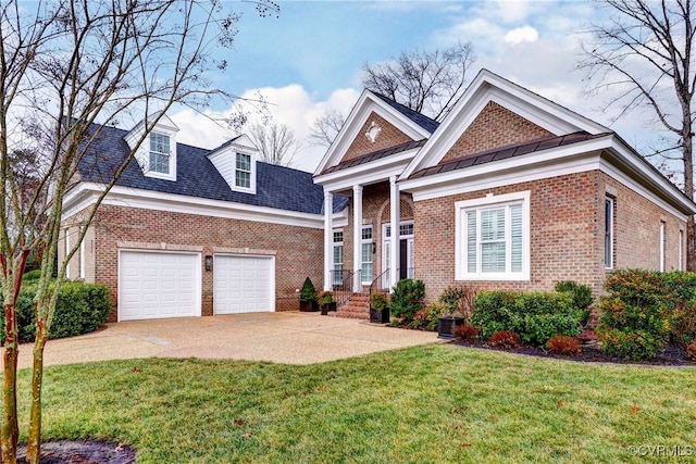 view of front of property featuring a garage and a front yard