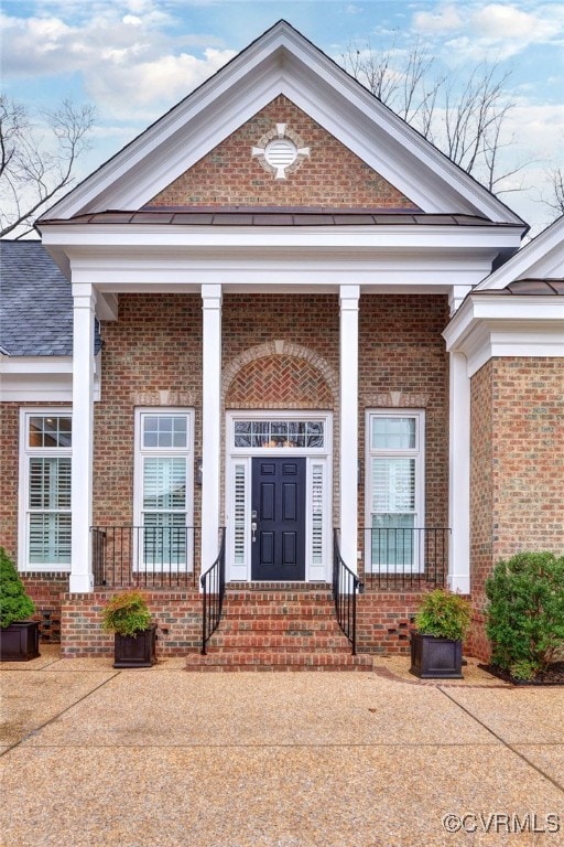 doorway to property featuring covered porch