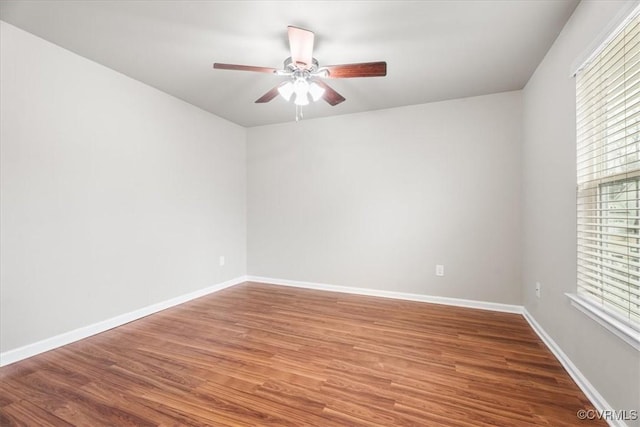 spare room featuring wood-type flooring and ceiling fan