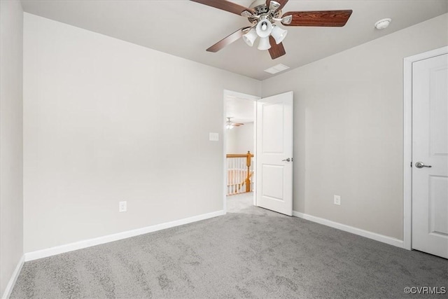 unfurnished bedroom featuring ceiling fan and carpet