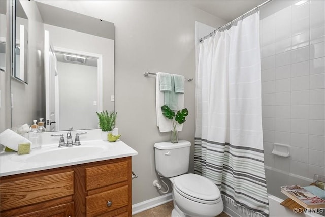 full bathroom with vanity, toilet, and shower / bath combo with shower curtain