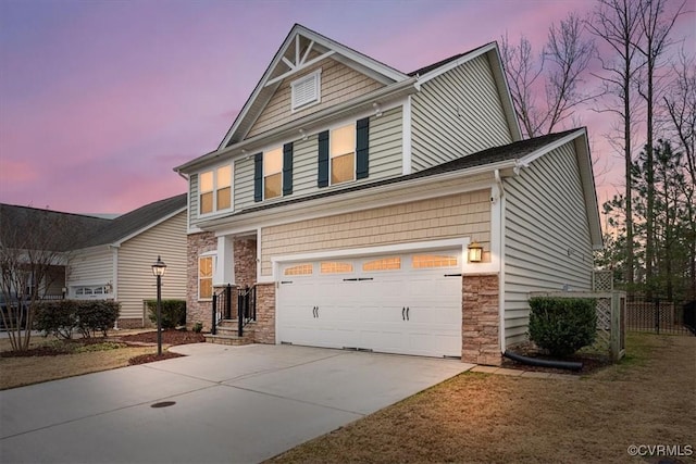 craftsman house with a garage