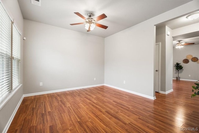 empty room featuring ceiling fan and wood-type flooring