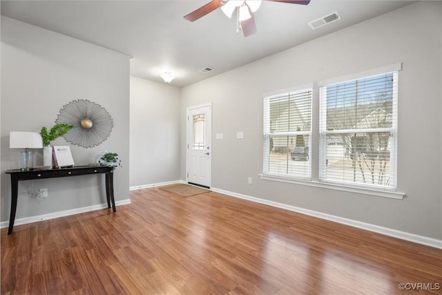 entrance foyer featuring hardwood / wood-style flooring and ceiling fan