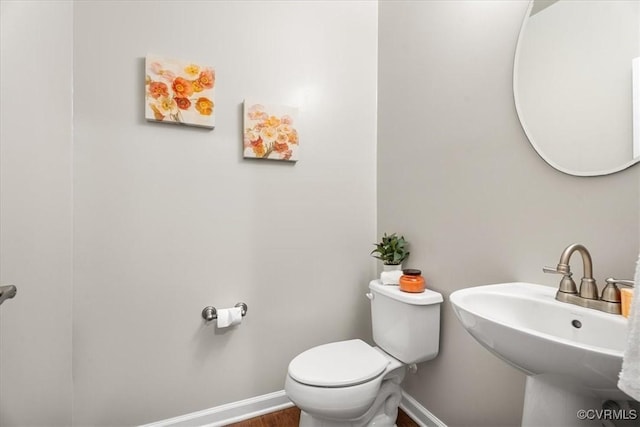 bathroom with sink and toilet