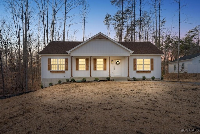 single story home featuring covered porch