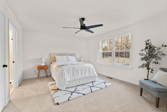 bedroom featuring ceiling fan and light colored carpet