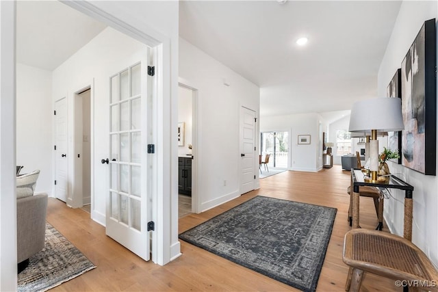 hallway with wood-type flooring