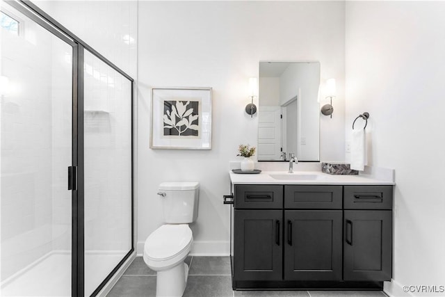 bathroom with tile patterned flooring, toilet, vanity, and walk in shower