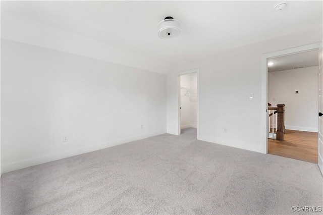 spare room with light colored carpet