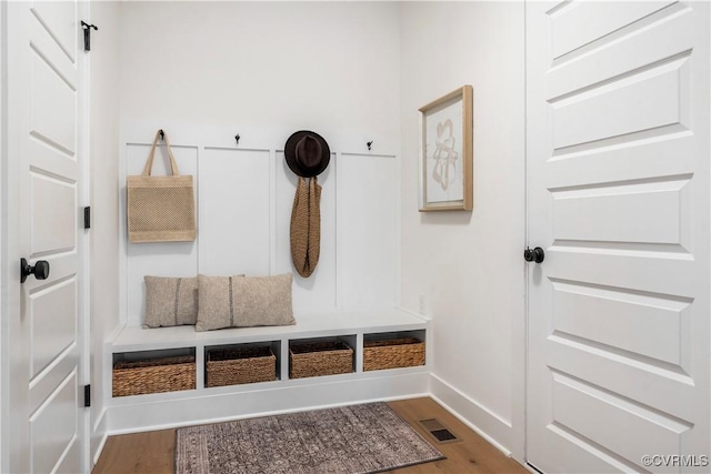 mudroom with wood-type flooring