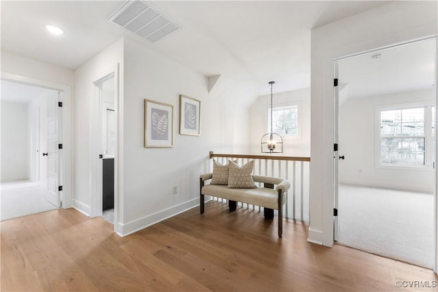 sitting room with wood-type flooring