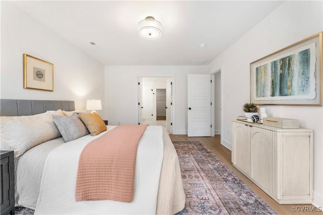 bedroom featuring wood-type flooring