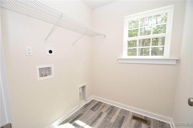 laundry room with hardwood / wood-style flooring, washer hookup, and electric dryer hookup