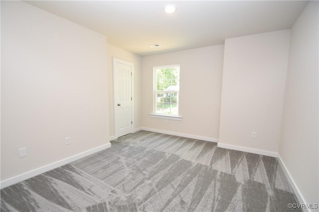 unfurnished room with carpet