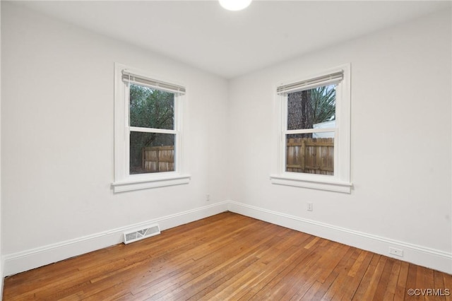 spare room featuring light hardwood / wood-style flooring