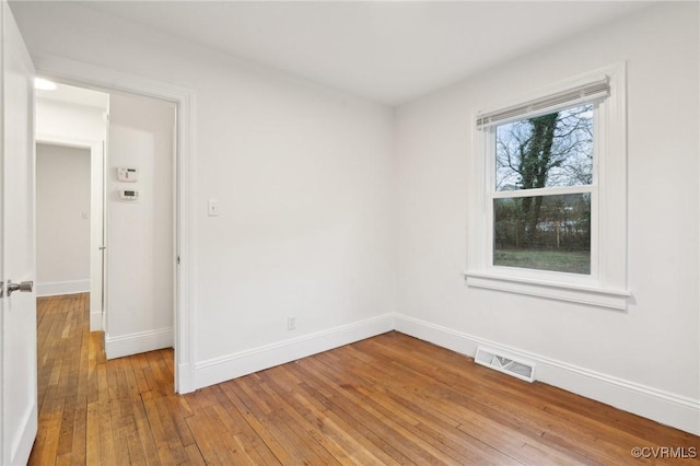 spare room featuring light hardwood / wood-style floors