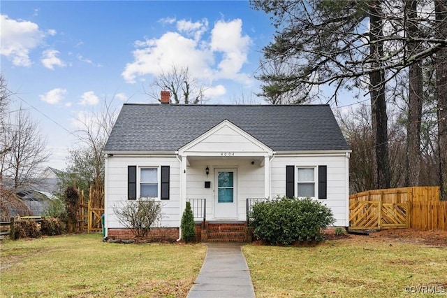 bungalow-style home featuring a front yard