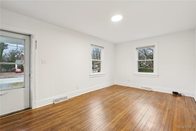 unfurnished room featuring dark hardwood / wood-style floors