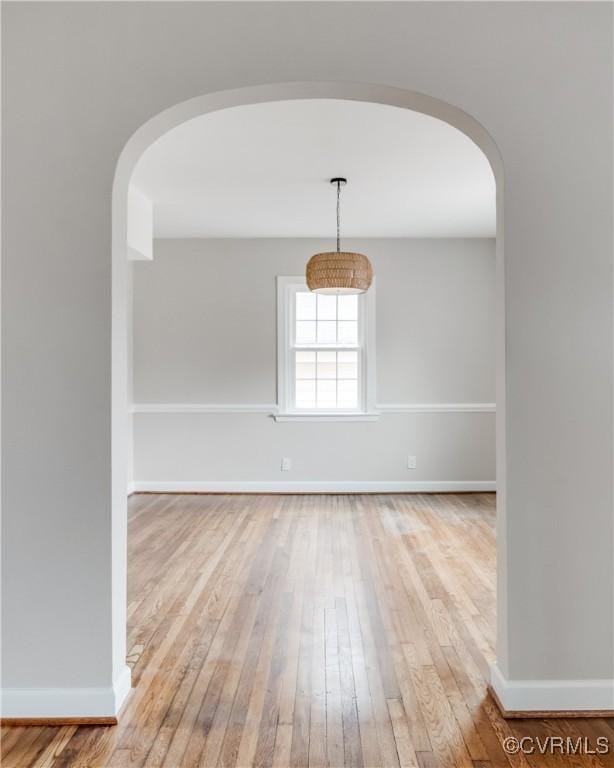 empty room with hardwood / wood-style flooring