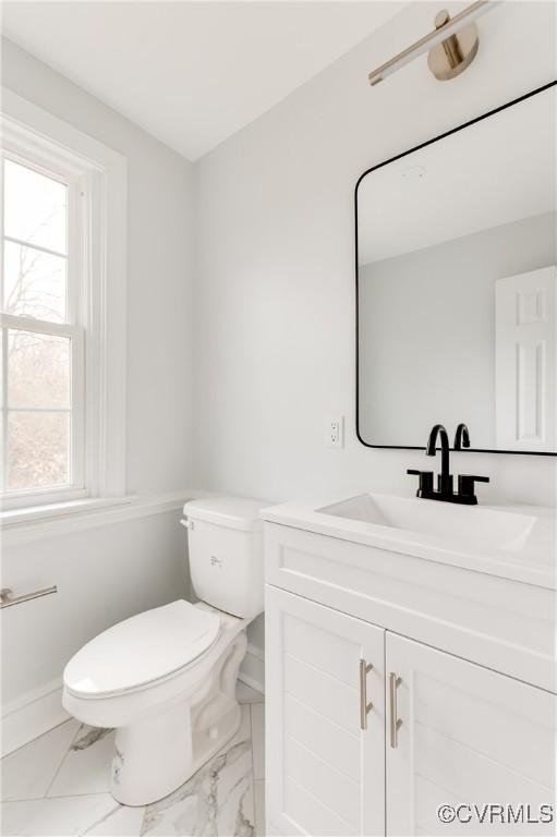 bathroom featuring vanity and toilet