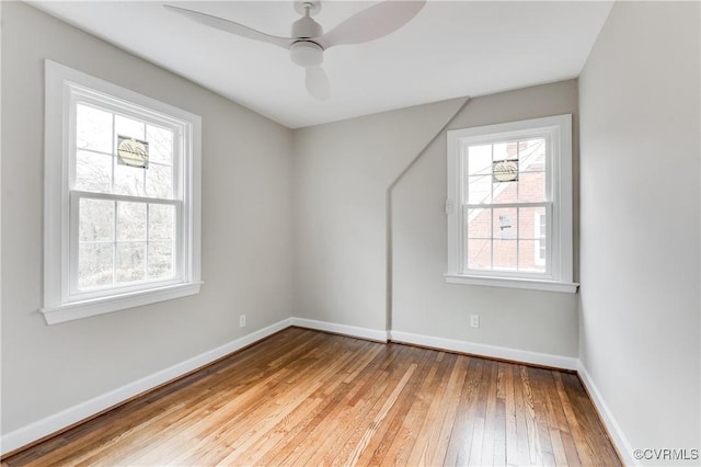 additional living space featuring plenty of natural light, light hardwood / wood-style floors, and ceiling fan