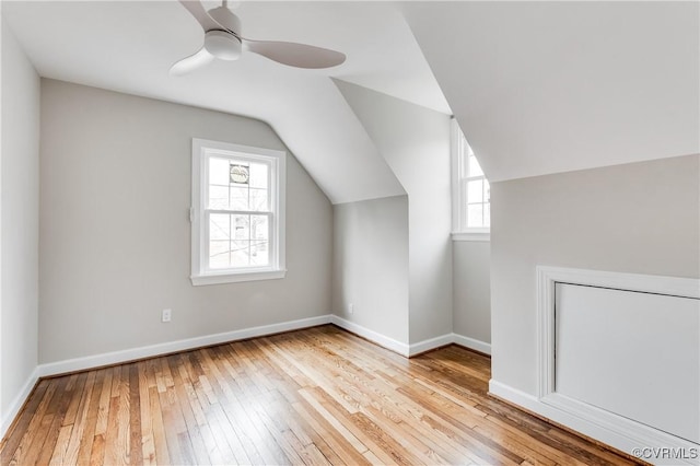 bonus room featuring light hardwood / wood-style flooring, ceiling fan, and vaulted ceiling