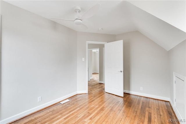 additional living space featuring lofted ceiling, light hardwood / wood-style flooring, and ceiling fan