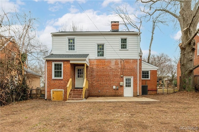 back of house with central AC unit and a patio area