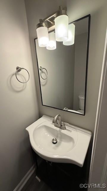 bathroom with sink and toilet