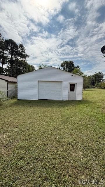 garage with a yard