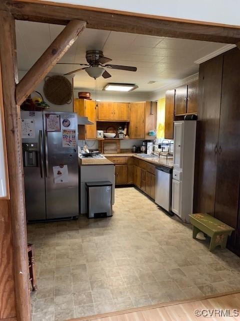 kitchen featuring ceiling fan, appliances with stainless steel finishes, and sink