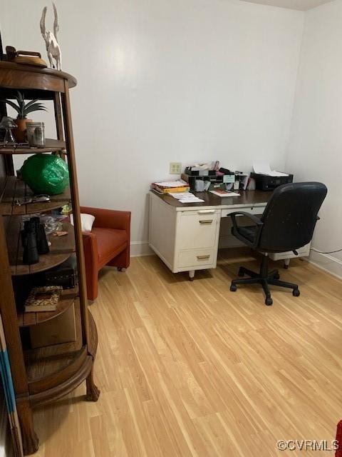 home office with light wood-type flooring