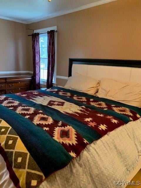 bedroom featuring ornamental molding