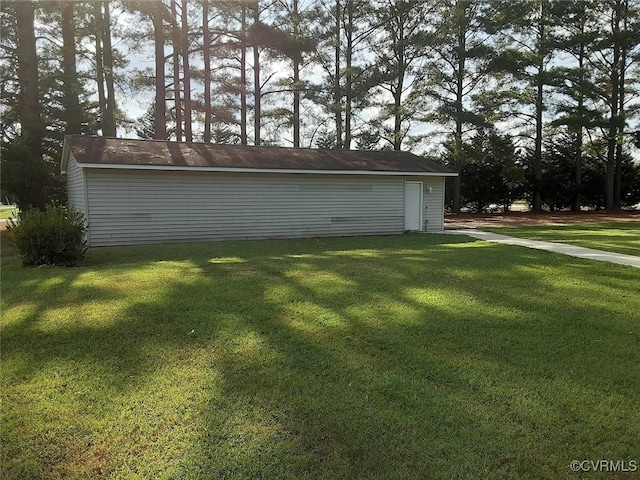 garage featuring a lawn