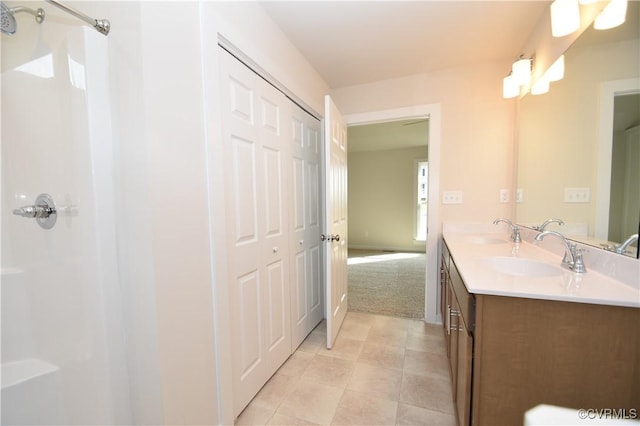 bathroom with vanity, tile patterned floors, and walk in shower