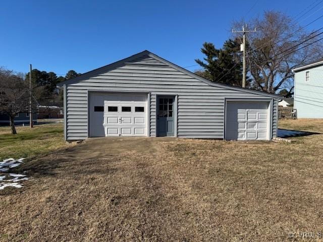 garage featuring a lawn