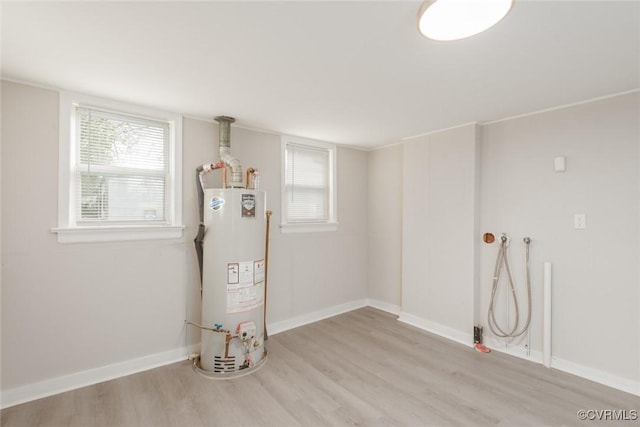 utility room featuring gas water heater