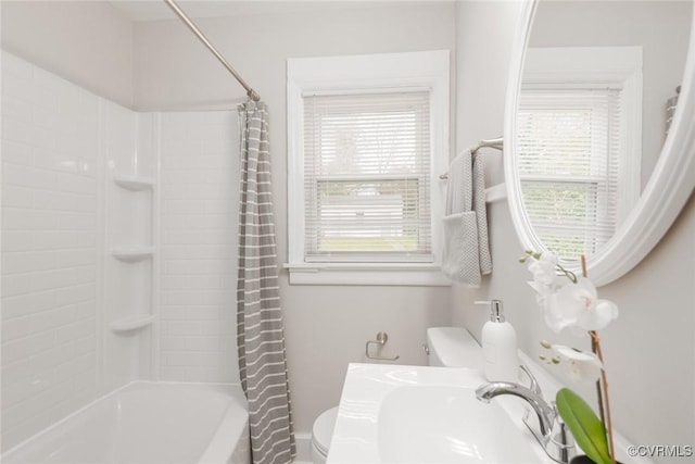 full bathroom with shower / tub combo, sink, and toilet