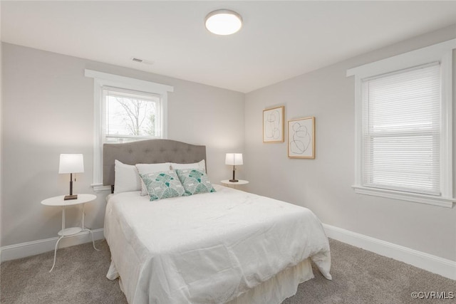 bedroom with light colored carpet