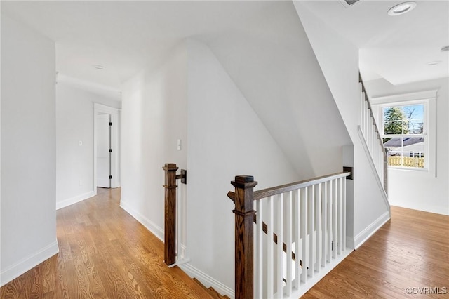 hallway with light hardwood / wood-style flooring