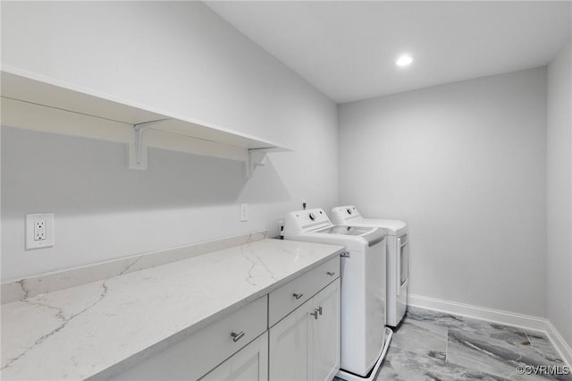 washroom featuring washer and clothes dryer