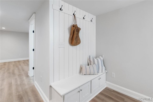 mudroom with light hardwood / wood-style floors