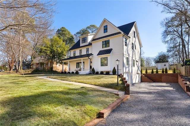 view of front of property with a front lawn and covered porch