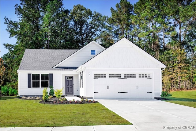 view of front of house featuring a garage and a front yard