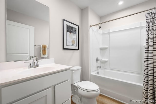 full bathroom with shower / bath combination with curtain, vanity, toilet, and hardwood / wood-style floors