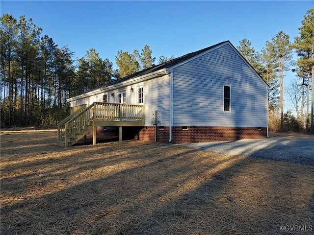 view of side of property with a deck